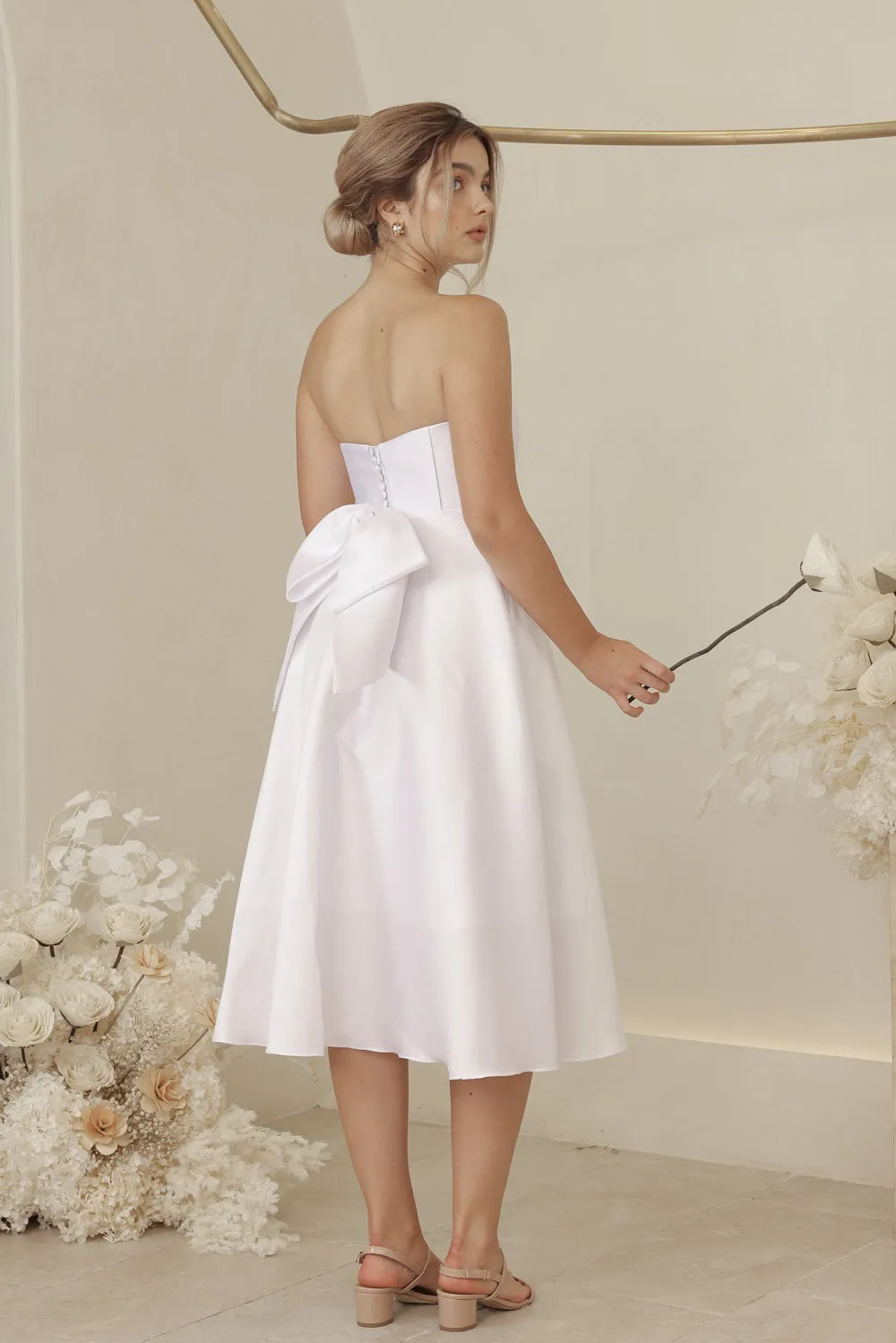 CELINE Strapless Curved Neckline Mid Length Gown with Bow, Pockets and Covered Buttons (White Gazaar)