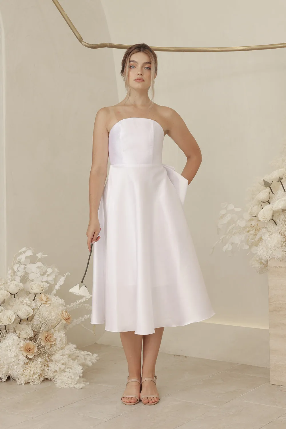 CELINE Strapless Curved Neckline Mid Length Gown with Bow, Pockets and Covered Buttons (White Gazaar)