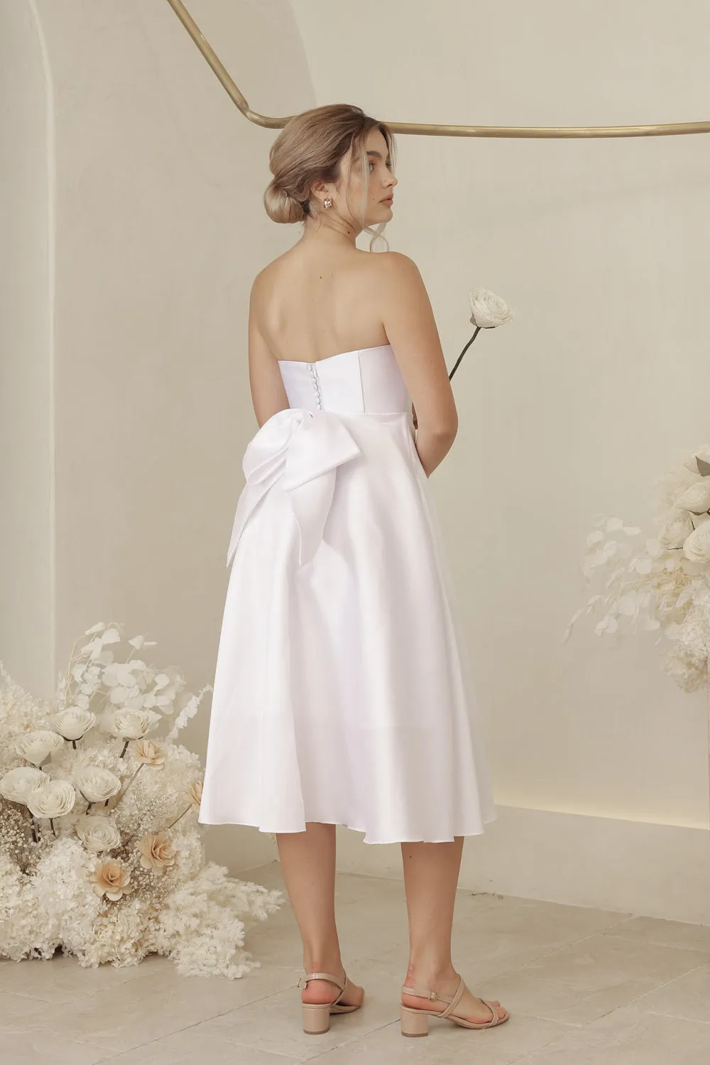 CELINE Strapless Curved Neckline Mid Length Gown with Bow, Pockets and Covered Buttons (White Gazaar)
