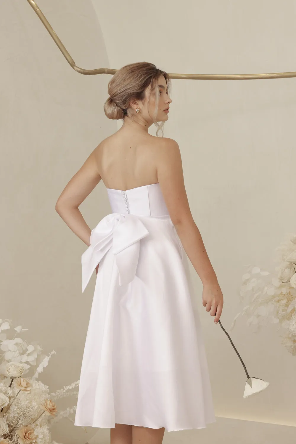 CELINE Strapless Curved Neckline Mid Length Gown with Bow, Pockets and Covered Buttons (White Gazaar)